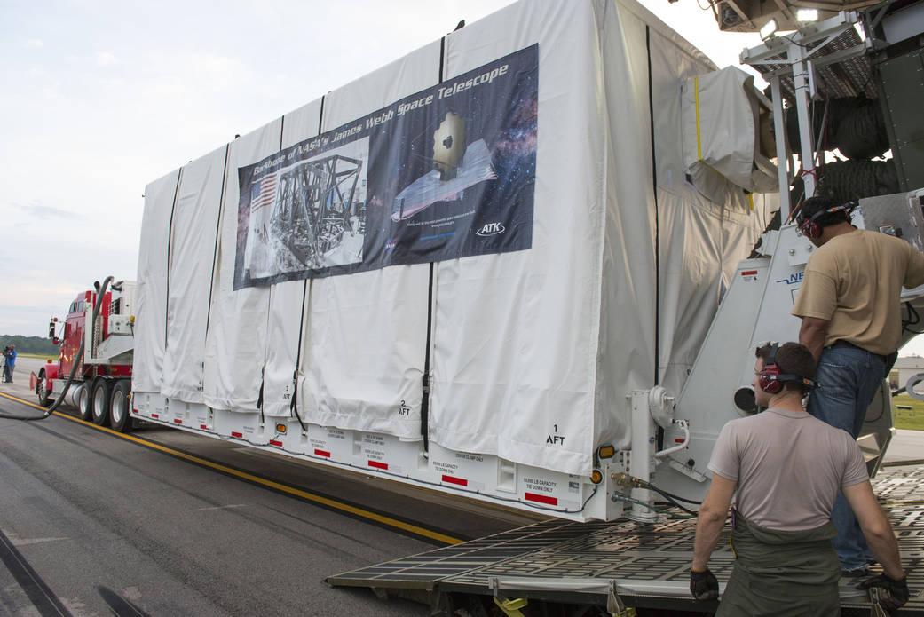 Crews unload the James Webb Space Telescope's "backplane," which was flown aboard a Lockheed C-5 airplane to NASA’s Marshall S