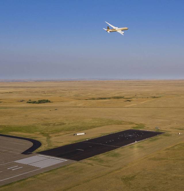 ecoDemonstrator program makes a low pass over a collection of microphones just past the end of the runway at a research facility