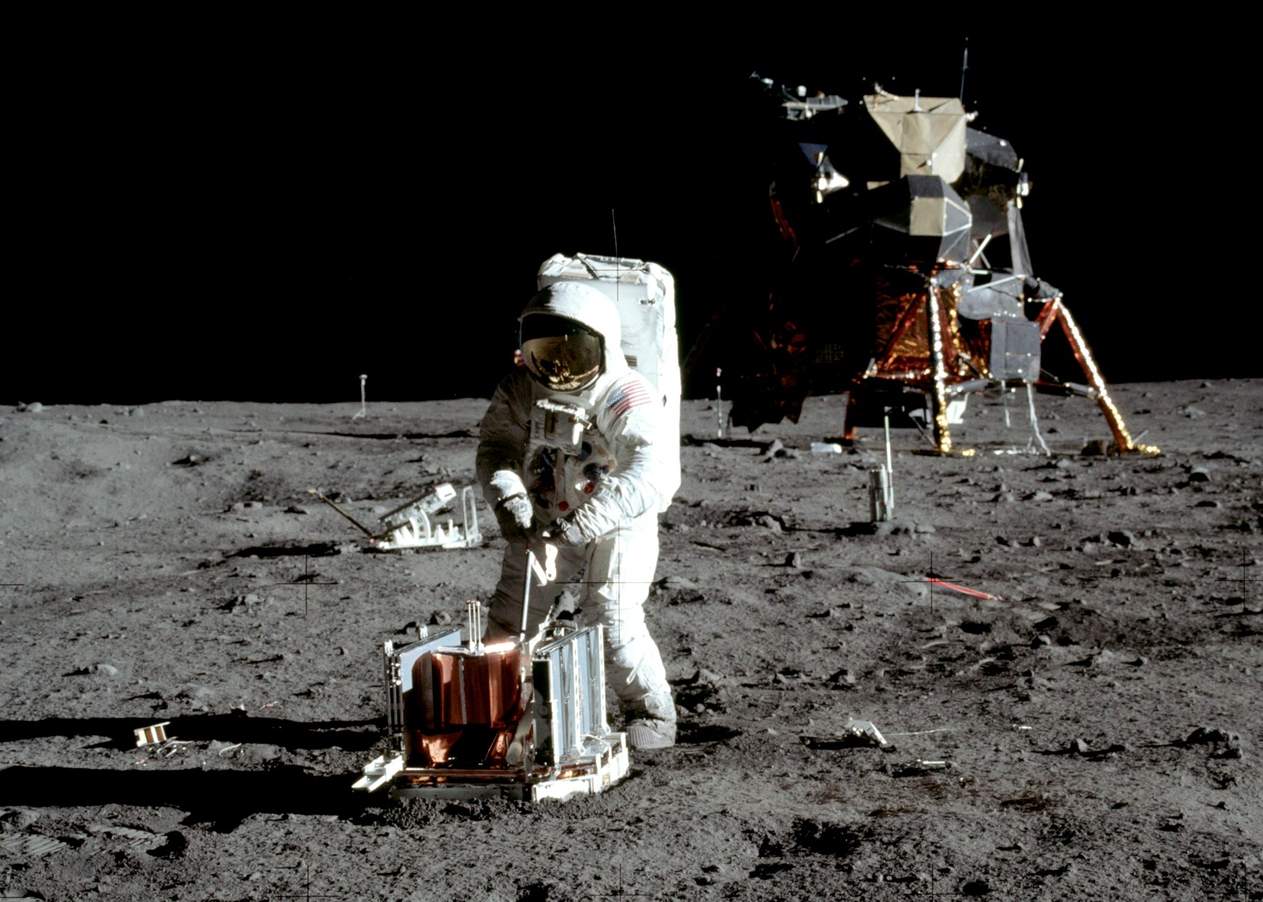 Apollo 11 lunar module pilot Buzz Aldrin deploys the Passive Seismic Experiment Package in the Sea of Tranquility.