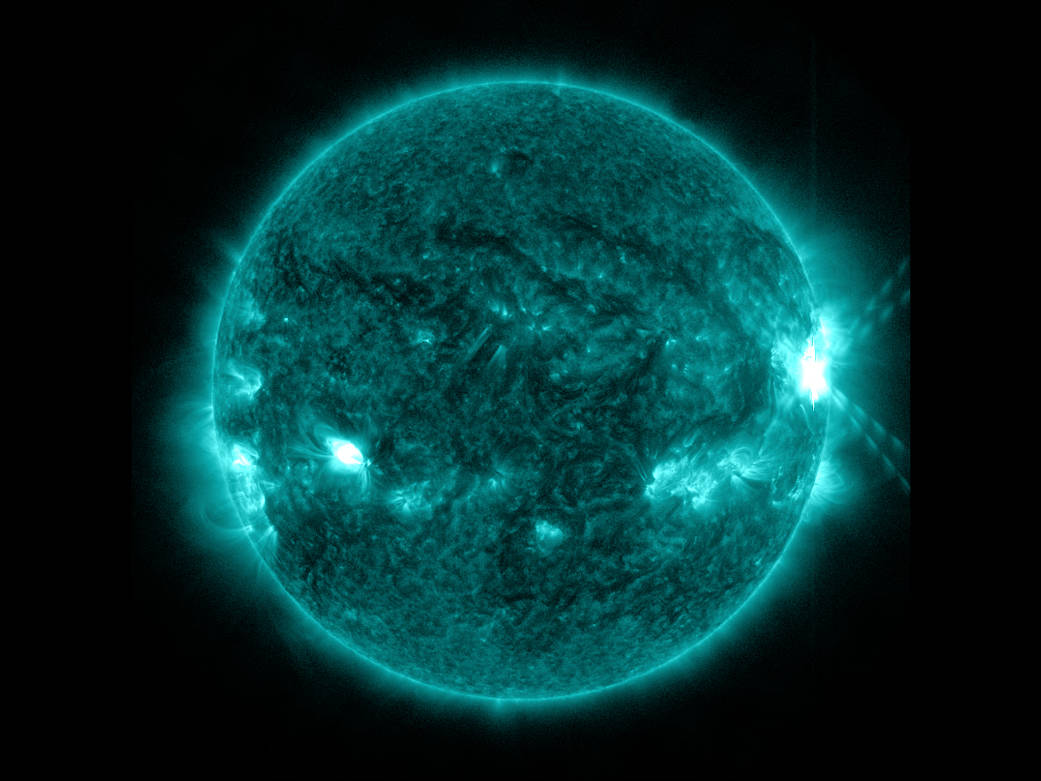 An X1.0-class flare exploded off the right side of the sun, peaking at 10:03 p.m. EDT on Oct. 27, 2013.