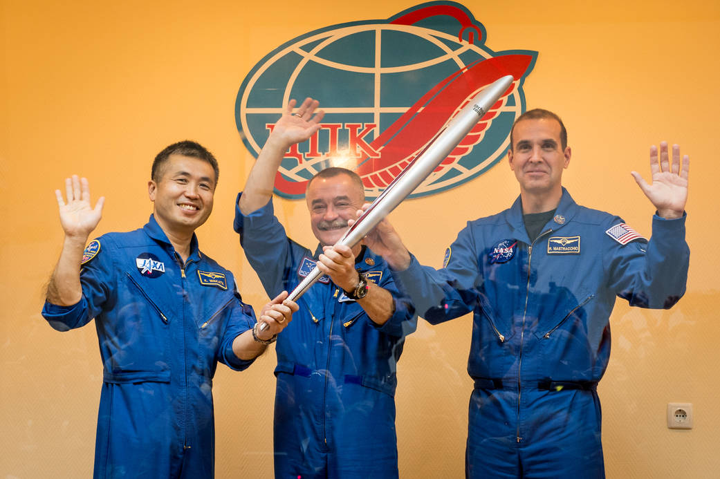 Expedition 38 Flight Engineer Koichi Wakata of the Japan Aerospace Exploration Agency, left, Soyuz Commander Mikhail Tyurin of R