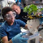 NASA astronauts Jessica Watkins and Bob Hines work on the XROOTS space botany investigation testing soilless methods to grow plants in microgravity.
