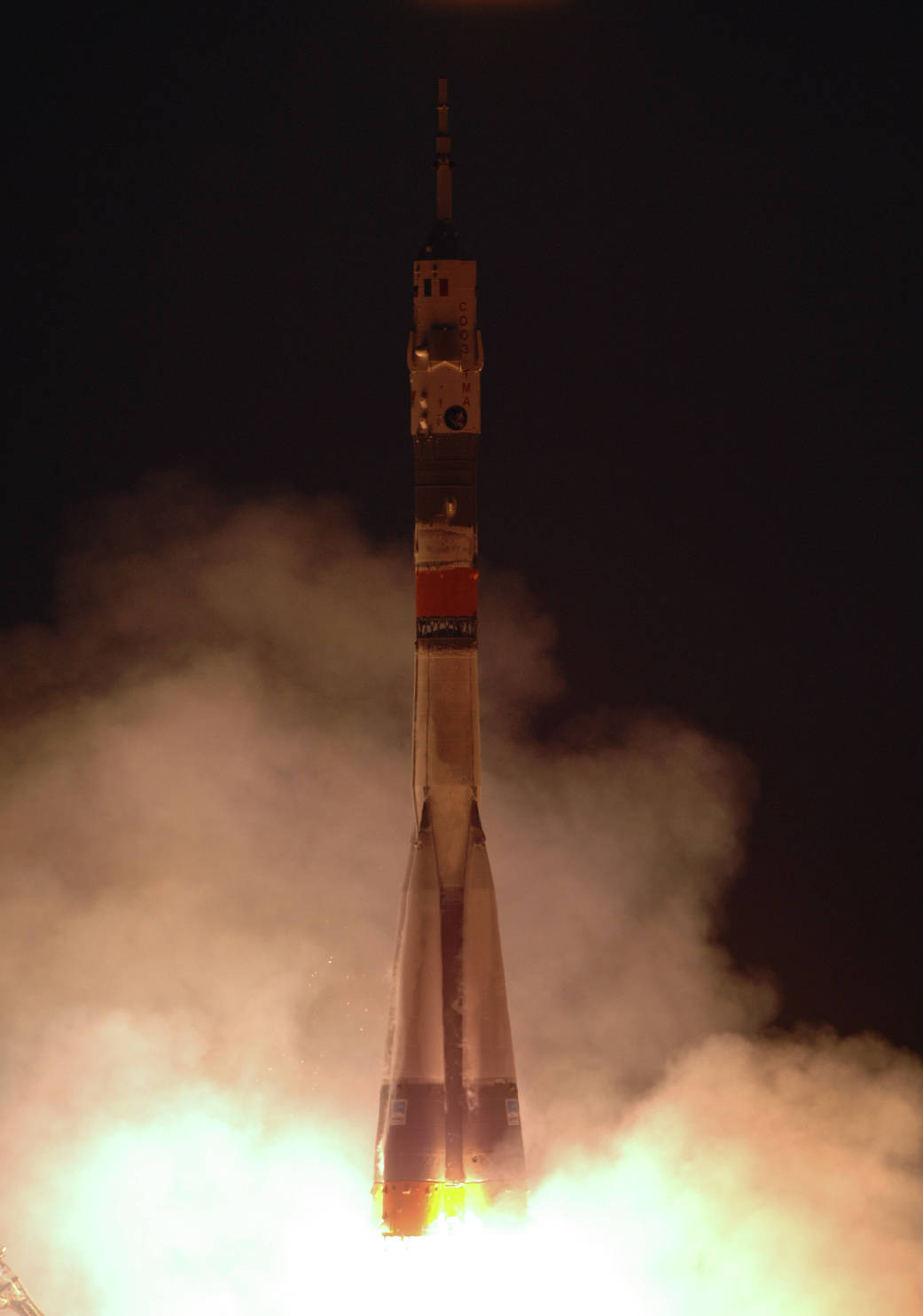 Soyuz rocket launch at night