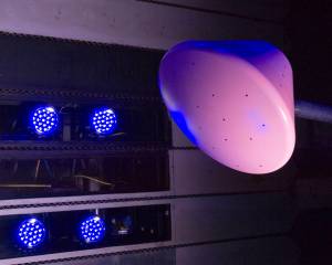 Blue-lit image of scale model of Crew Exploration Vehicle (CEV).