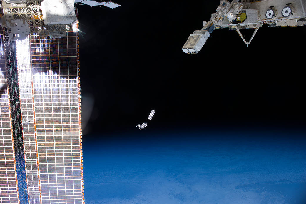 A set of NanoRacks CubeSats is photographed by an Expedition 38 crew member after the deployment by the NanoRacks Launcher attac