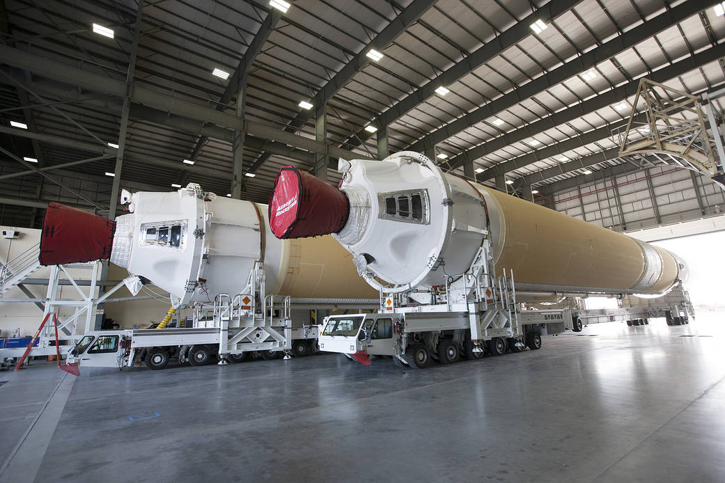A barge arrives at the U.S. Army Outpost wharf at Port Canaveral in Florida, carrying two of the three United Launch Alliance De