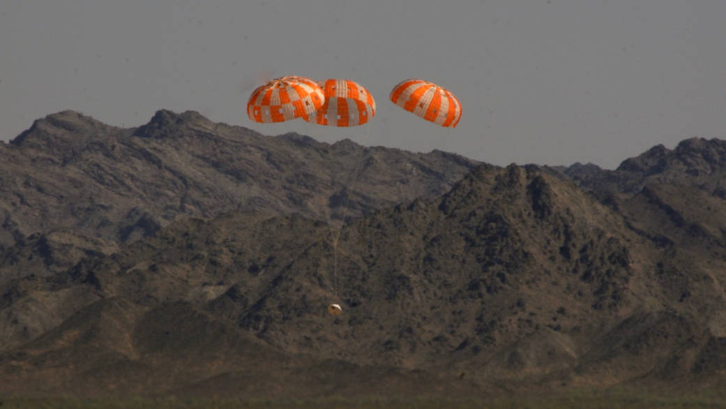 A test version of NASA’s Orion spacecraft descends under its three main parachutes above the U.S. Army Proving Ground in Arizo