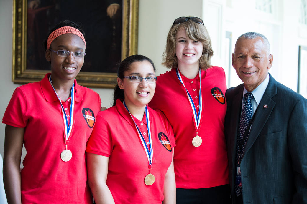 NASA Administrator Charles Bolden poses with an all-girl engineering team that participated in the White House Science Fair.