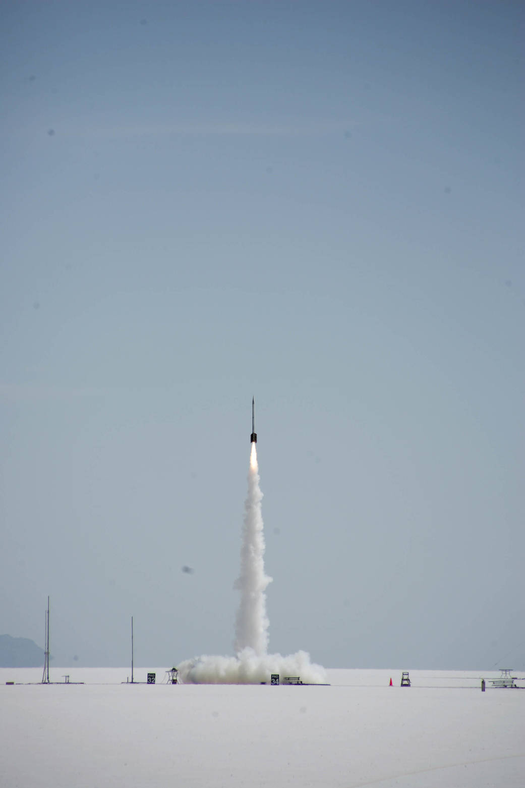 A student-built rocket lifts off the brilliant white hardpan of the Bonneville Salt Flats in Tooele County, Utah, May 17, during