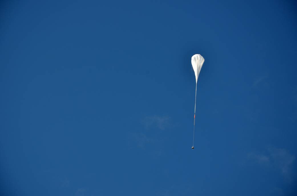 The test vehicle for NASA's Low-Density Supersonic Decelerator rides on a balloon to high altitudes above Hawaii. 