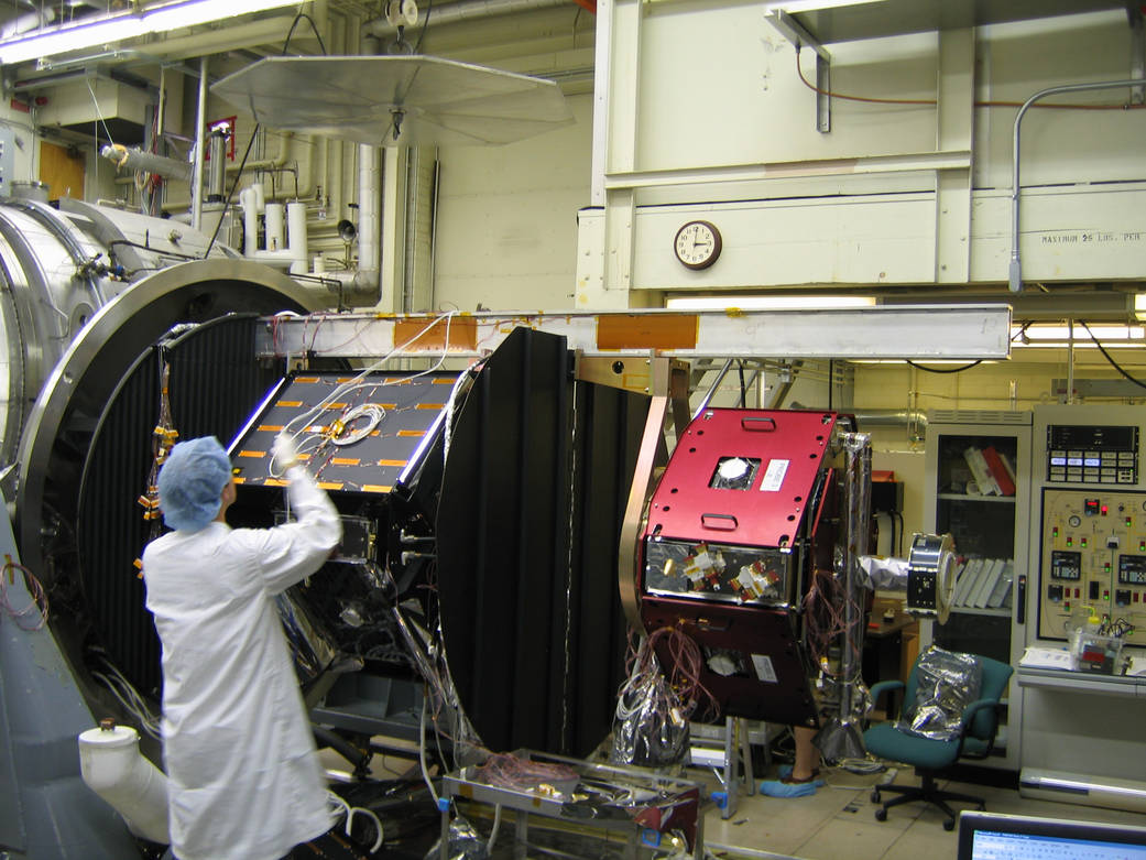 THEMIS Probes 3 and 4 being prepared for Thermal Vacuum chamber. Probe 3 in its box.