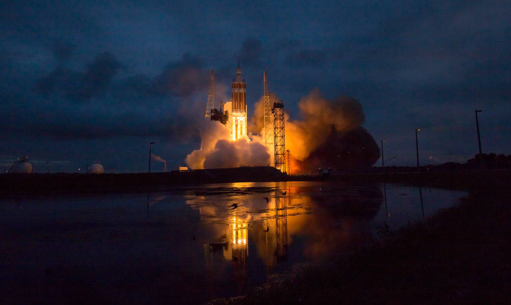 The United Launch Alliance Delta IV Heavy rocket with NASA’s Orion spacecraft mounted atop, lifts off from Cape Canaveral Air 