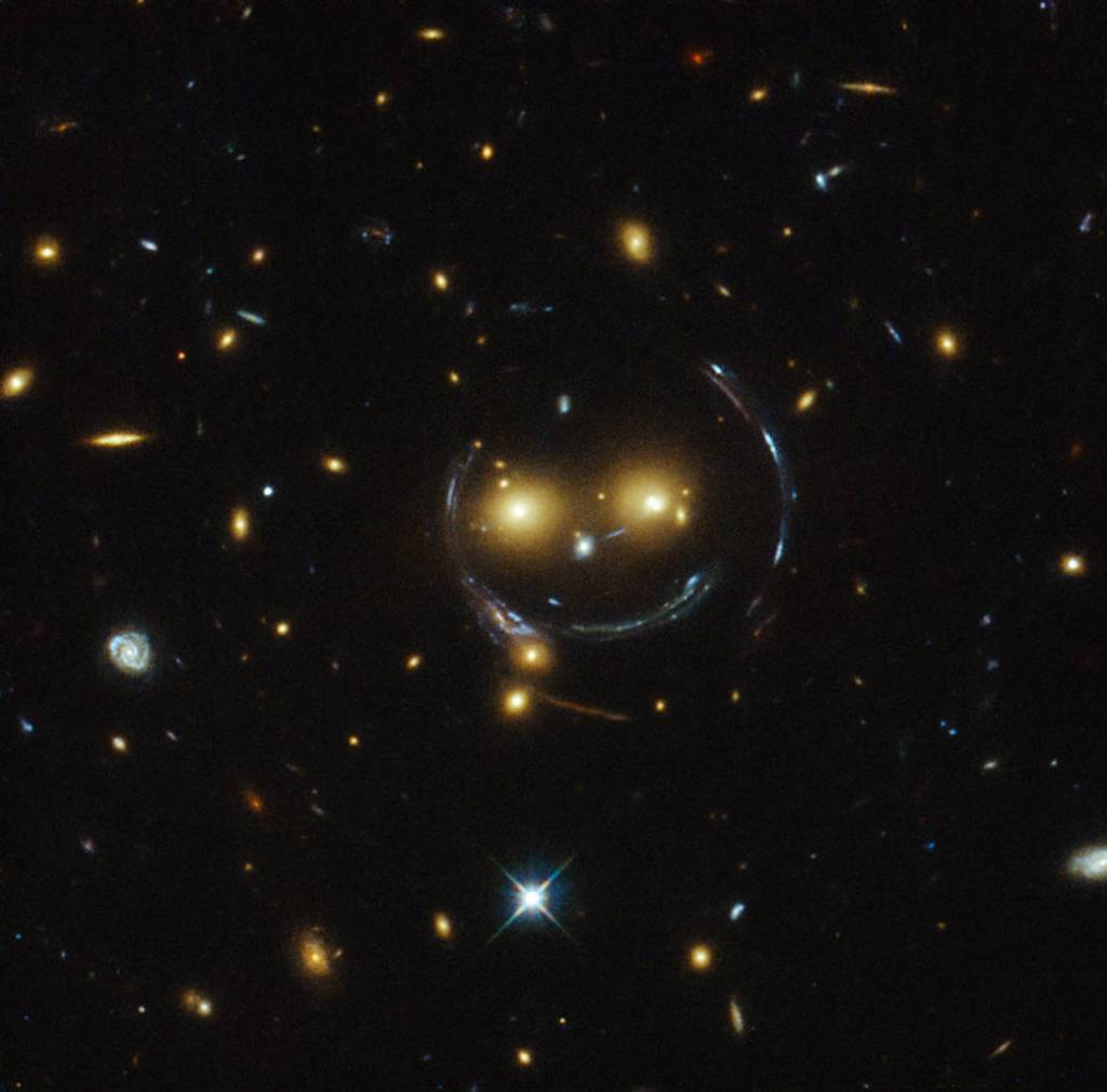 Image, taken with the NASA/ESA Hubble Space Telescope, is the galaxy cluster SDSS J1038+4849