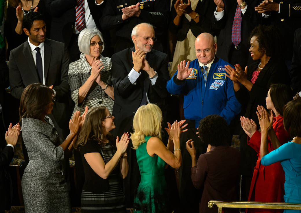 NASA astronaut Scott Kelly stands as he is recognized by President Barack Obama.