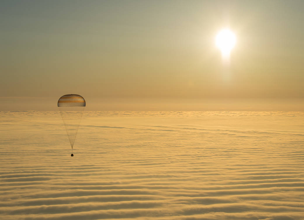 The Soyuz TMA-14M spacecraft is seen as it lands with Expedition 42 commander Barry Wilmore of NASA, Alexander Samokutyaev of the Russian Federal Space Agency (Roscosmos) and Elena Serova of Roscosmos near the town of Dzhezkazgan, Kazakhstan, on Wednesday, March 11, 2015 (Thursday, March 12, Kazakh time).