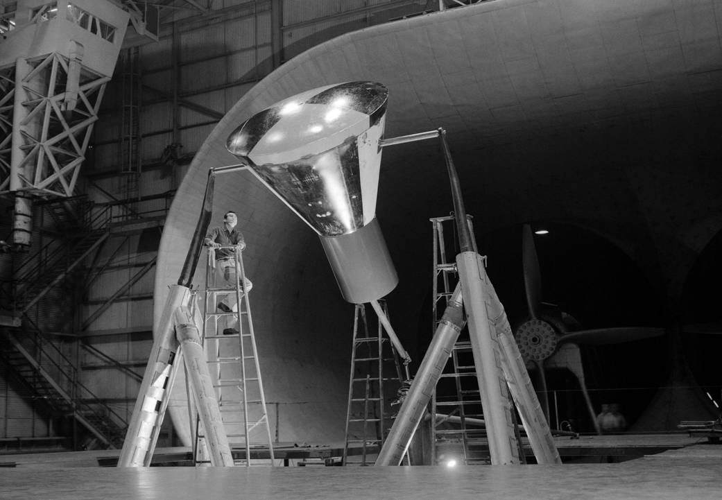 Technician checks Mercury capsule model