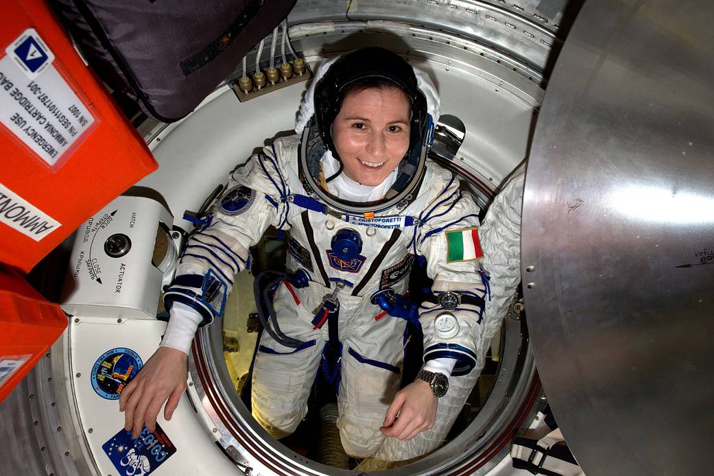 Samantha Cristoforetti in Sokol pressure suit inside hatch door aboard space station