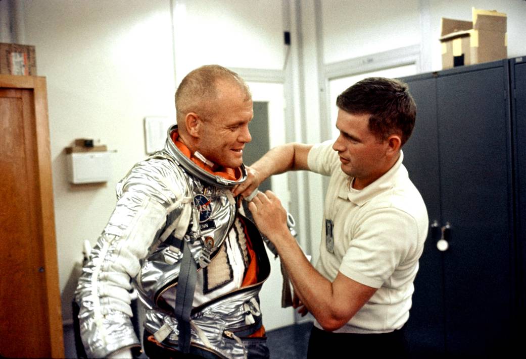 John Glenn suits up during preflight activities.
