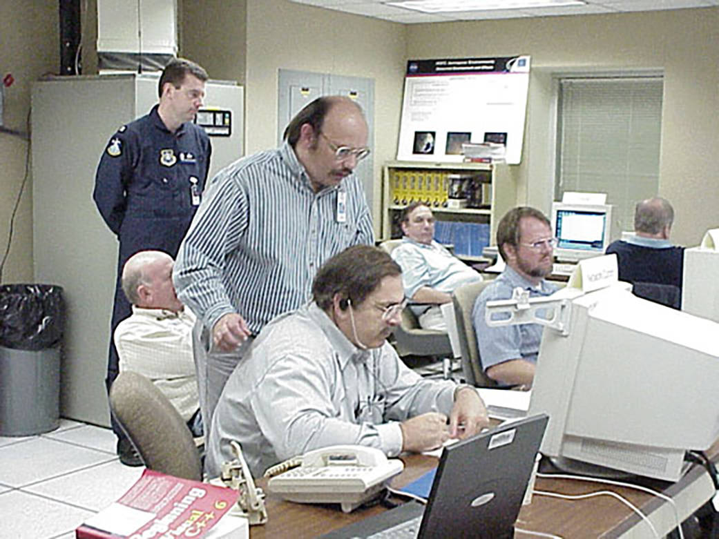 NASA engineers and scientists coordinating worldwide meteor data collection in 2001