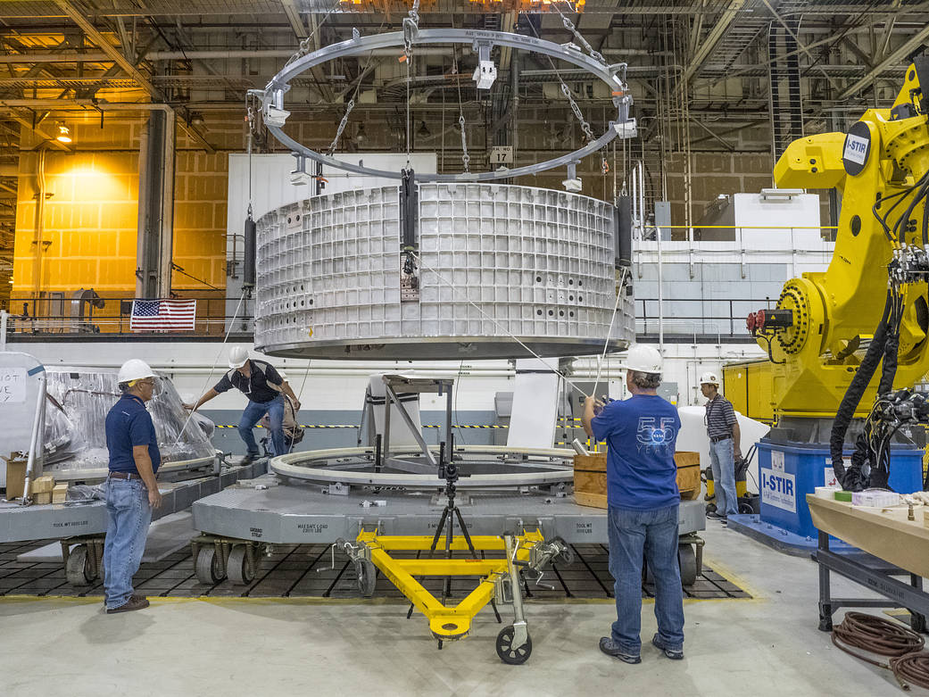 Pieces for the Orion spacecraft that will fly on Exploration Mission 1 are being prepared for welding 