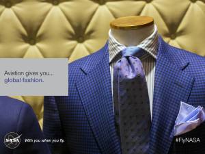 Aviation gives you...global fashion. Image of a man's blue suit with shirt and tie on a mannequin with a yellow tufted wall in the background.