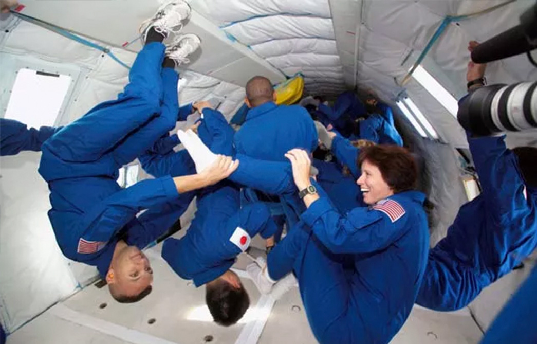 astronauts tumble during one of a series of reduced gravity sessions
