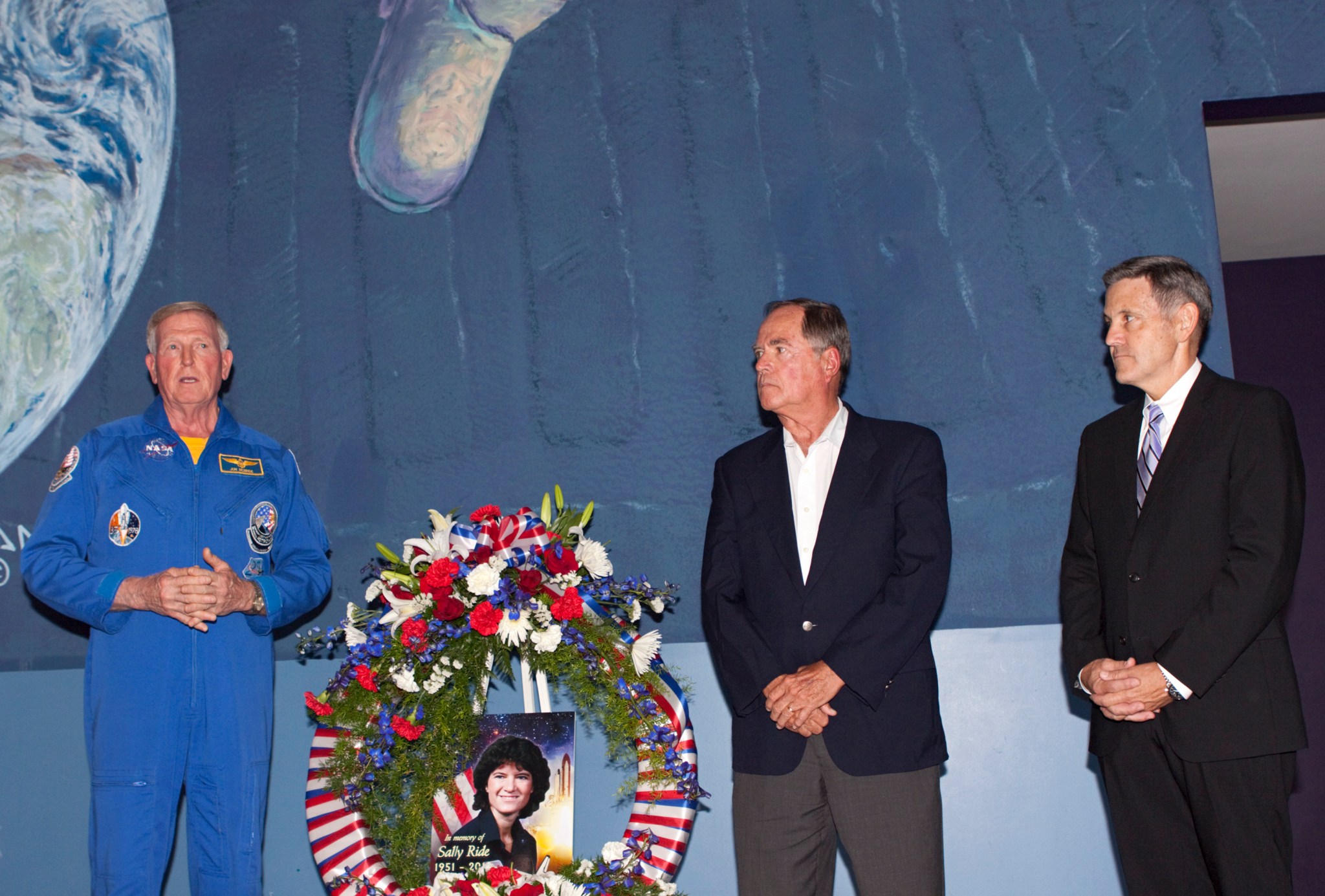 Former astronauts Jon McBride, Bob Crippen and Bob Cabana, lay a wreath honoring Sally K. Ride