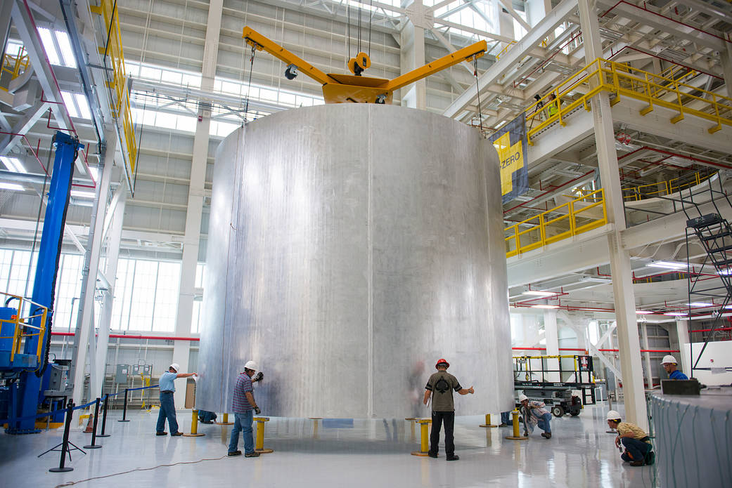 Engineers at NASA's Michoud Assembly Facility transfer a barrel section of the SLS core stage from the Vertical Weld Center.