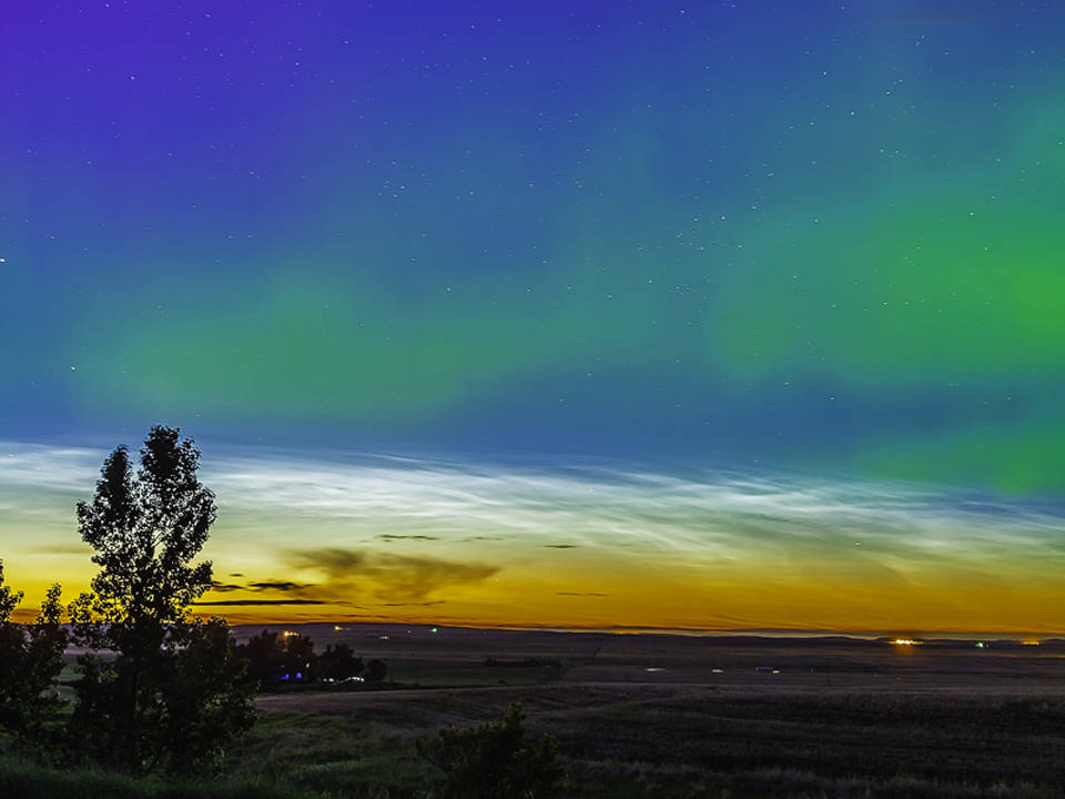 Twilight, noctilucent clouds and aurora viewed on June 9, 2013 from Alberta, Canada.