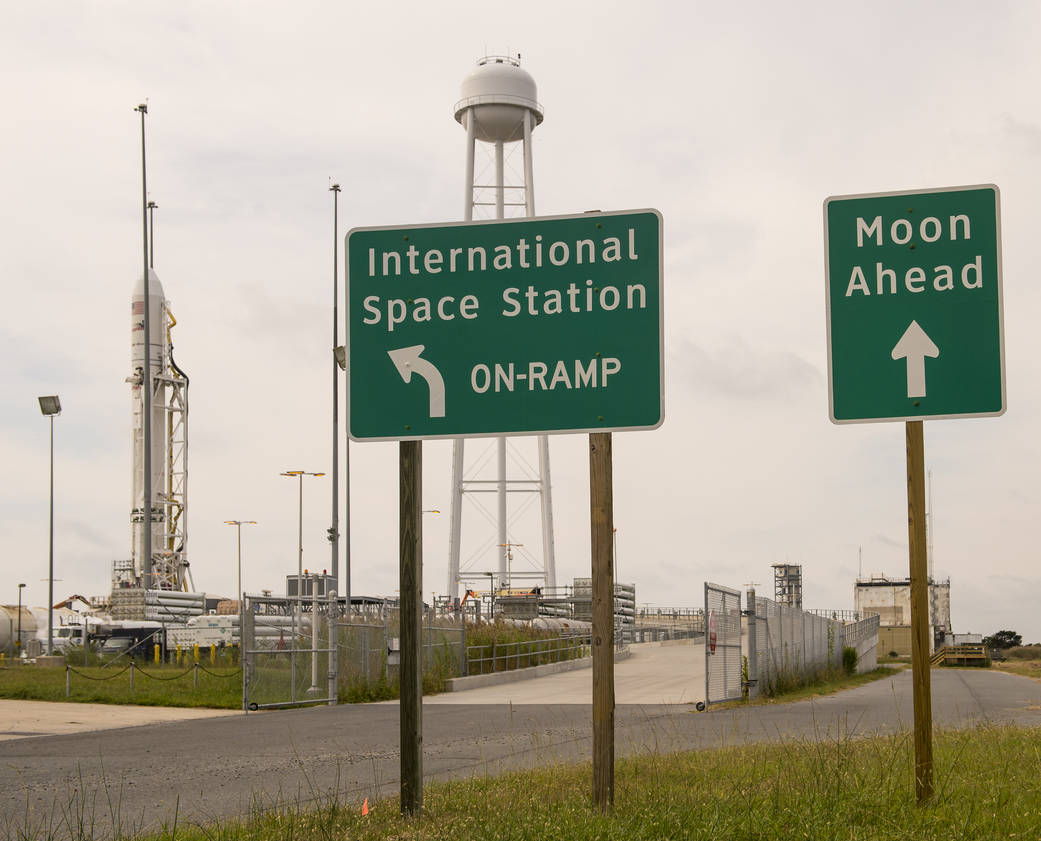 Antares rocket on Pad-0A at Wallops Flight Facility in background, signs in foreground, on Sept. 16, 2013.