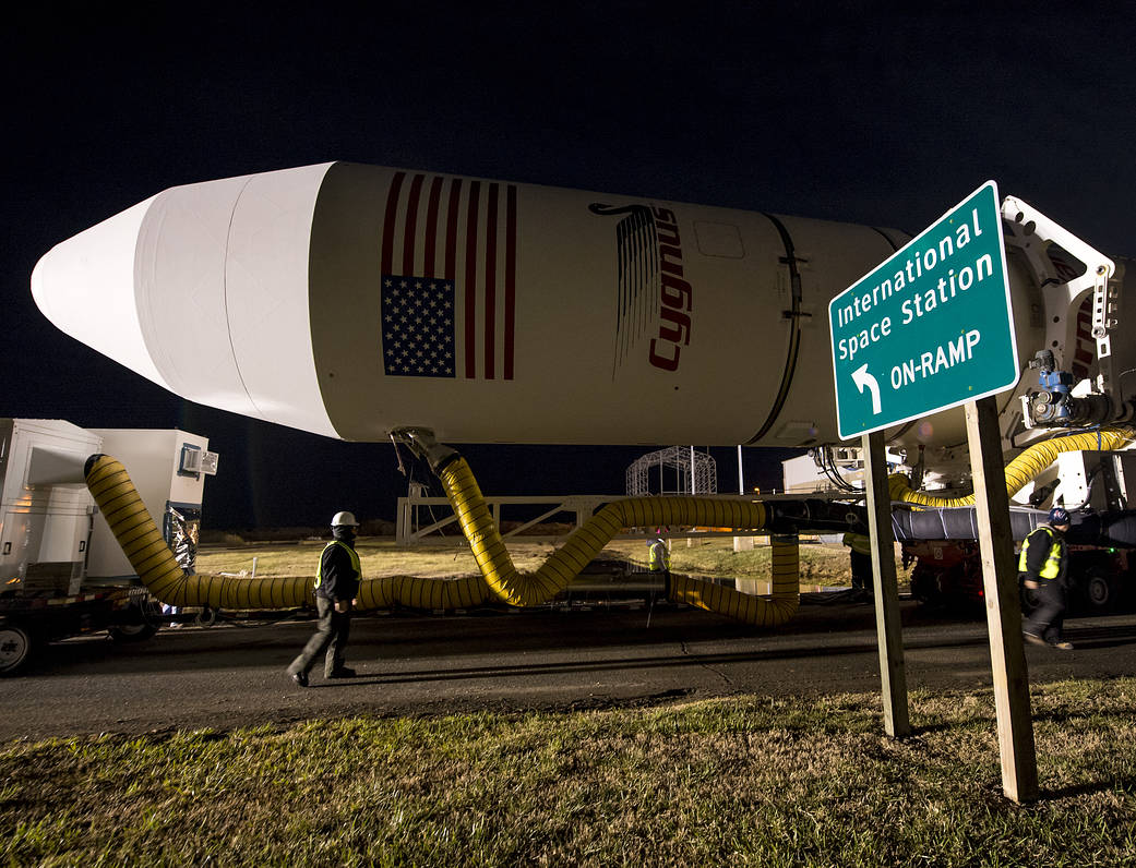 An Orbital Science Corporation Antares rocket is seen as it is rolled out to launch Pad-0A at NASA's Wallops Flight Facility Tue