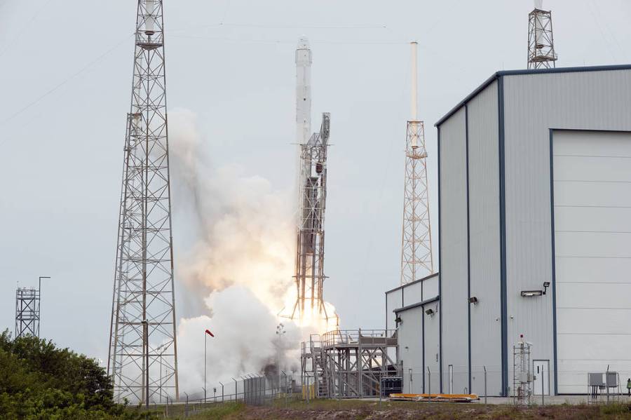 The SpaceX Falcon 9 rocket and Dragon spacecraft launch from Cape Canaveral Air Force Station