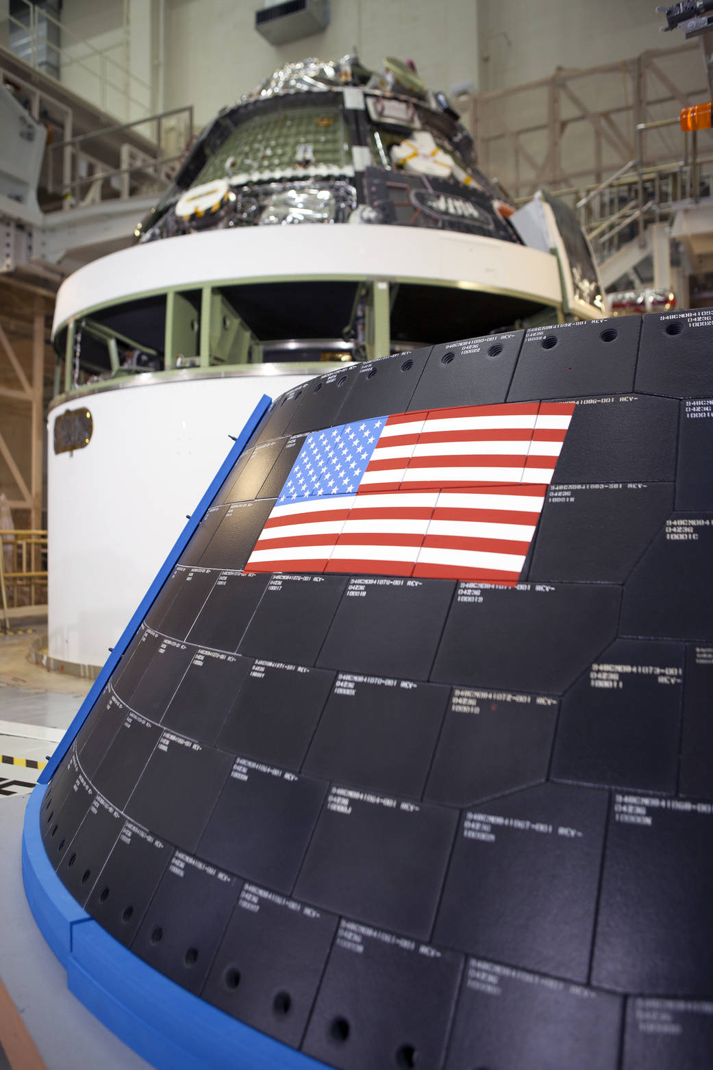 NASA's Orion spacecraft crew module has been stacked on the service module inside the Operations and Checkout Building at Kenned