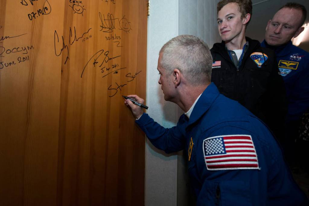 Astronaut Steve Swanson Signs Door at Cosmonaut Hotel