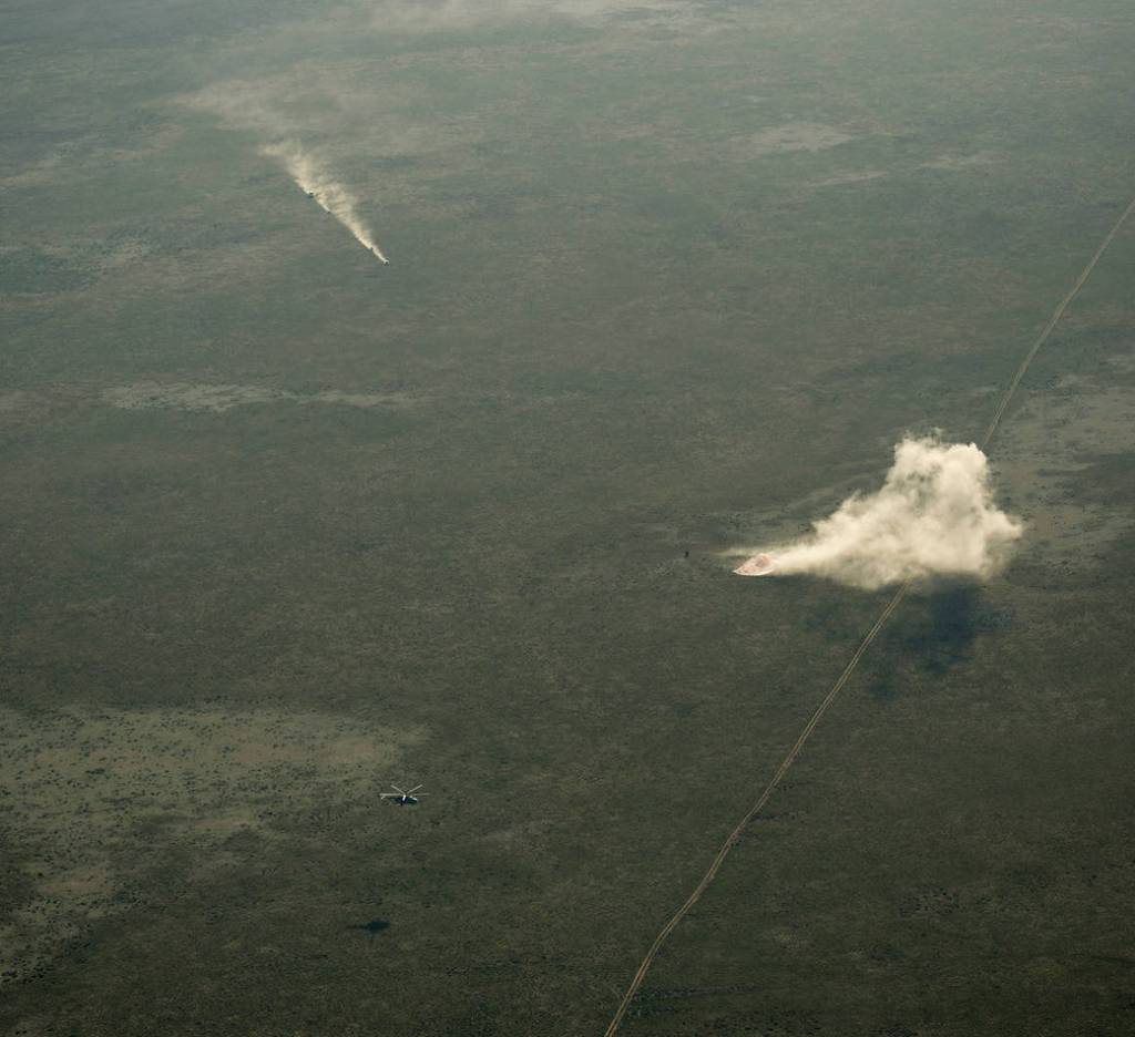 Ground Personnel Race to Soyuz Landing Site