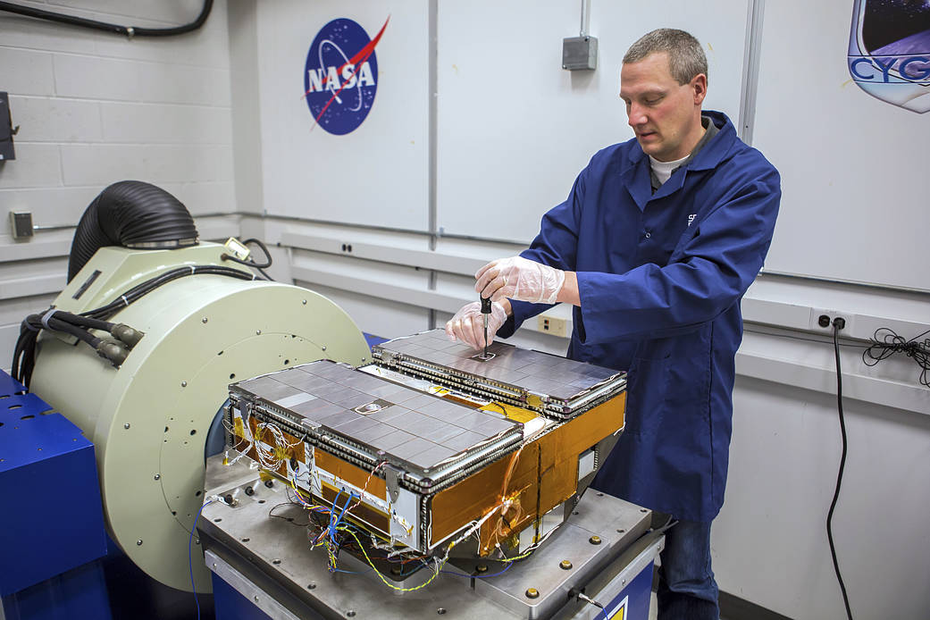 Jonathan Van Noord calibrates CYGNSS in the lab, December 2014.