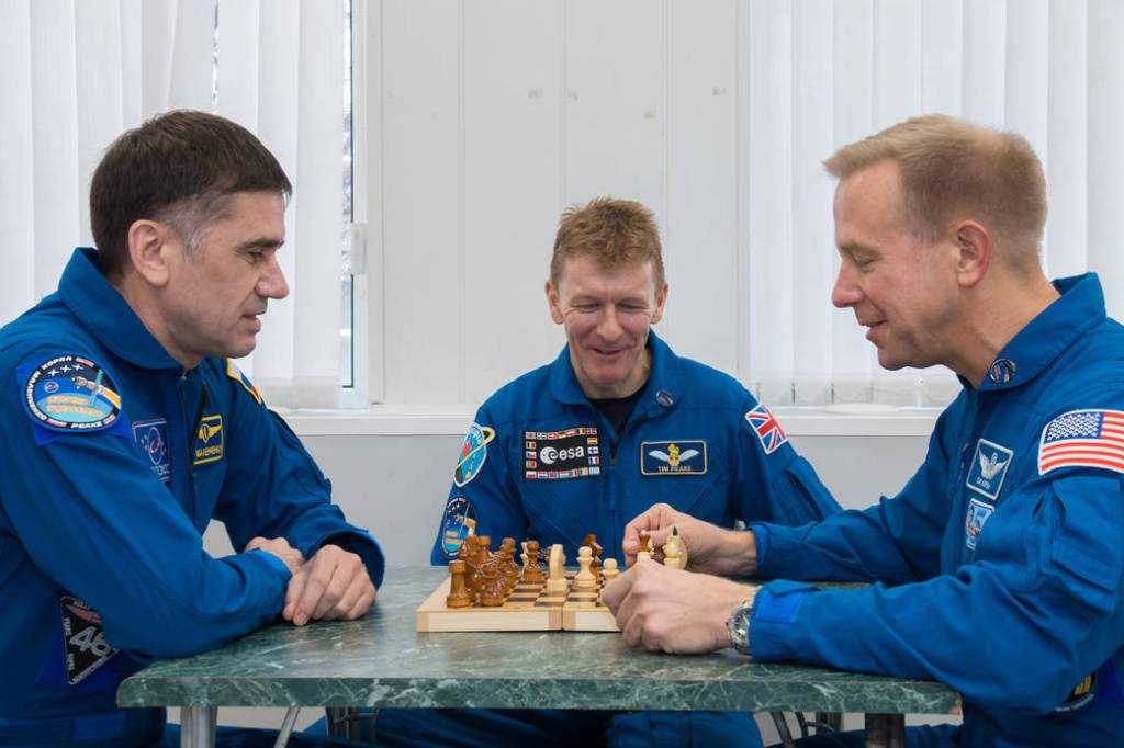 Expedition 46-47 Crew Members Play Chess