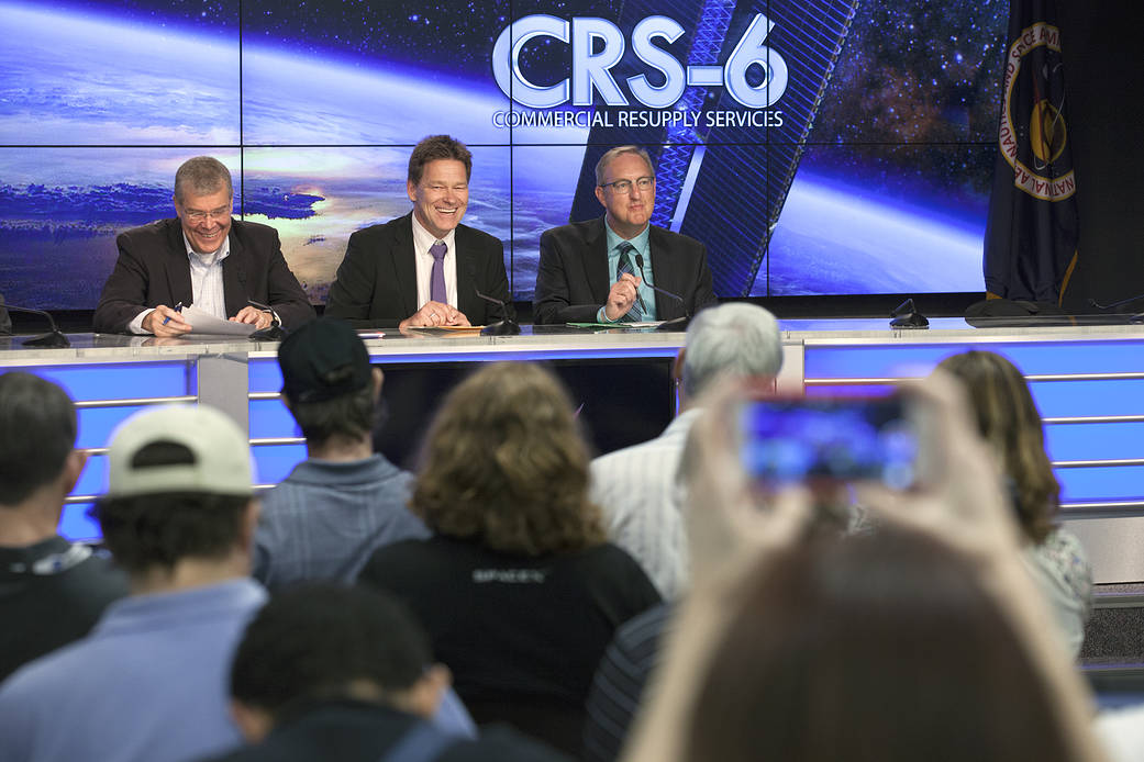 Agency and industry leaders enjoy a light moment at a prelaunch news conference for SpaceX CRS-6