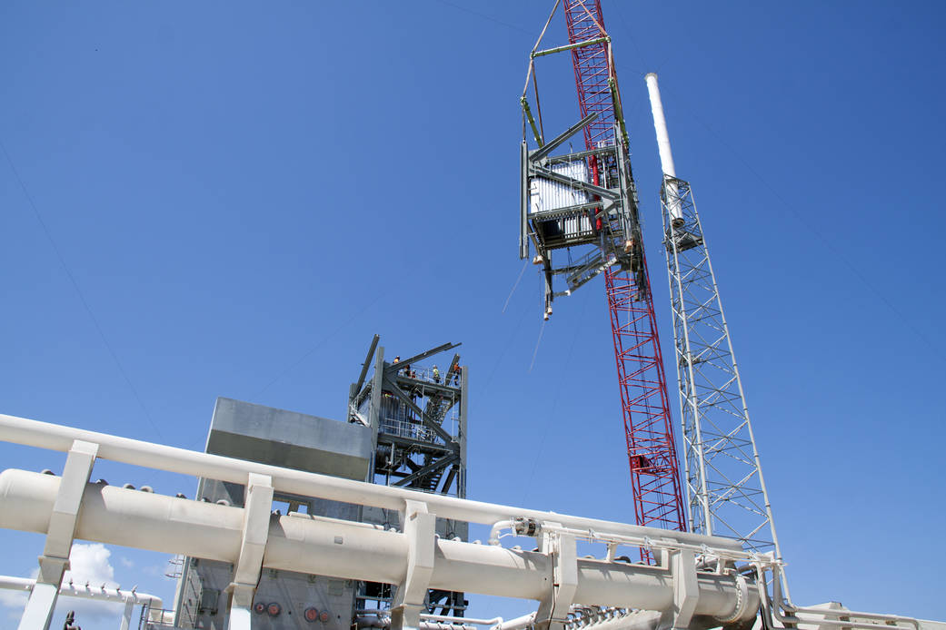A crane stacks the fourth tier for the Crew Access Tower