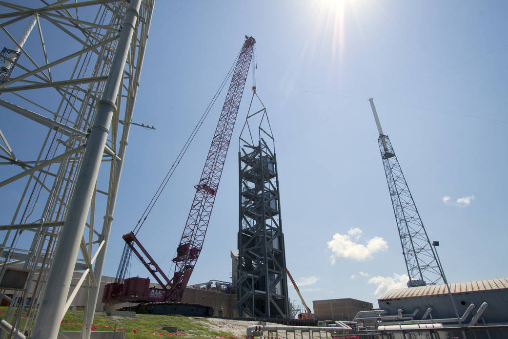 A crane stacks the fourth tier for the Crew Access Tower
