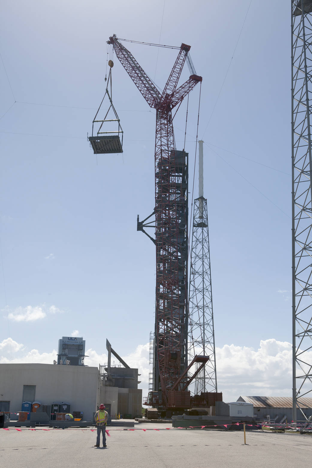 Crane lifts roof into place on Crew Access Tower