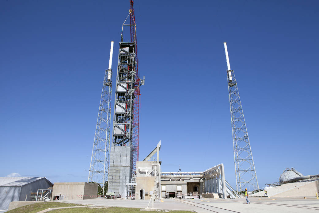 Crane lifts roof into place on Crew Access Tower