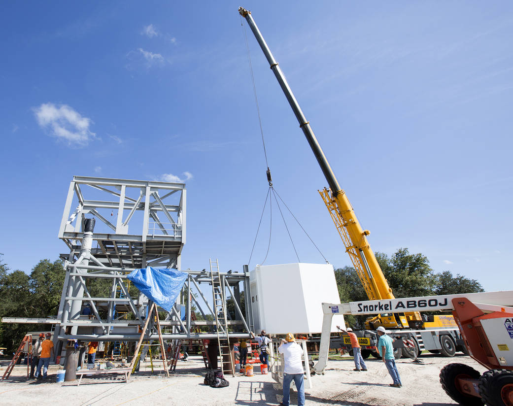 Workers connect White Room to Crew Access Arm