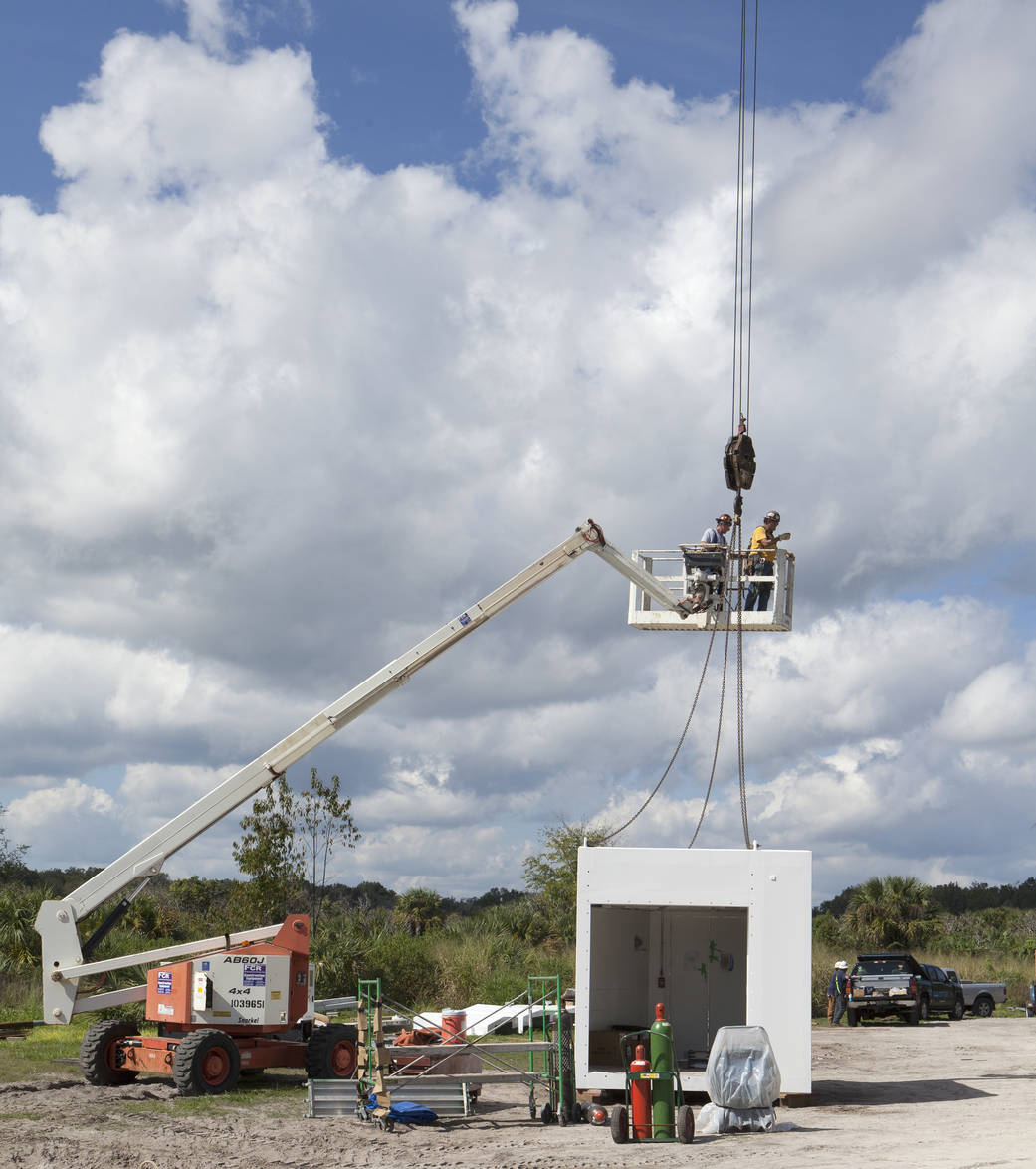 Workers connect White Room to Crew Access Arm