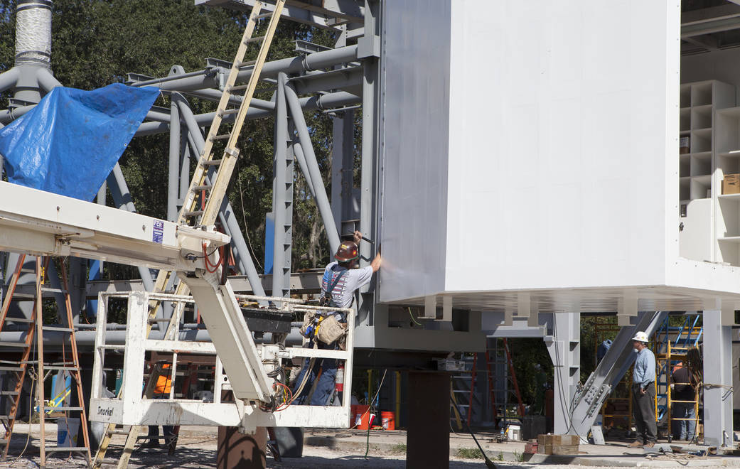 Workers connect White Room to Crew Access Arm
