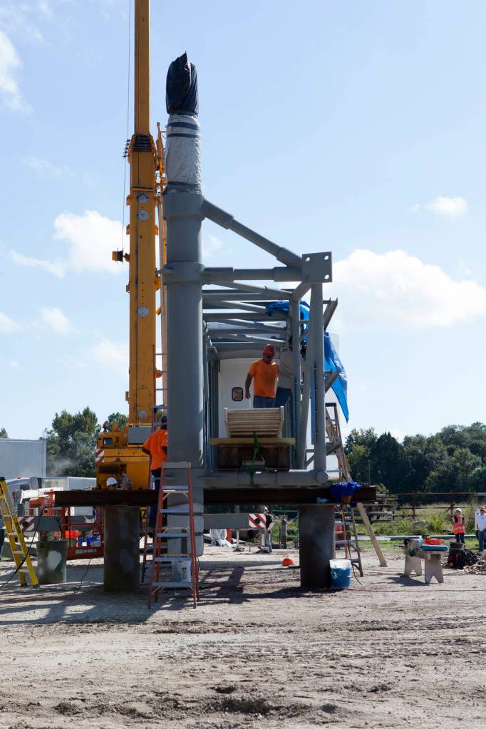 Workers Complete White Room Attachment
