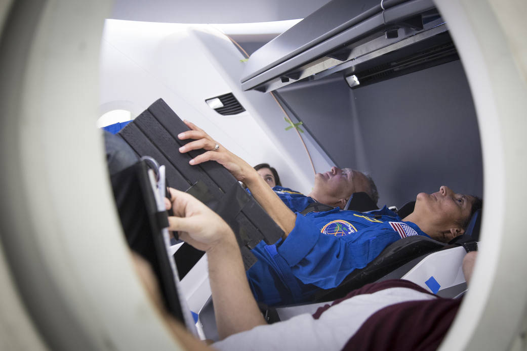 Astronauts in Crew Dragon mockup