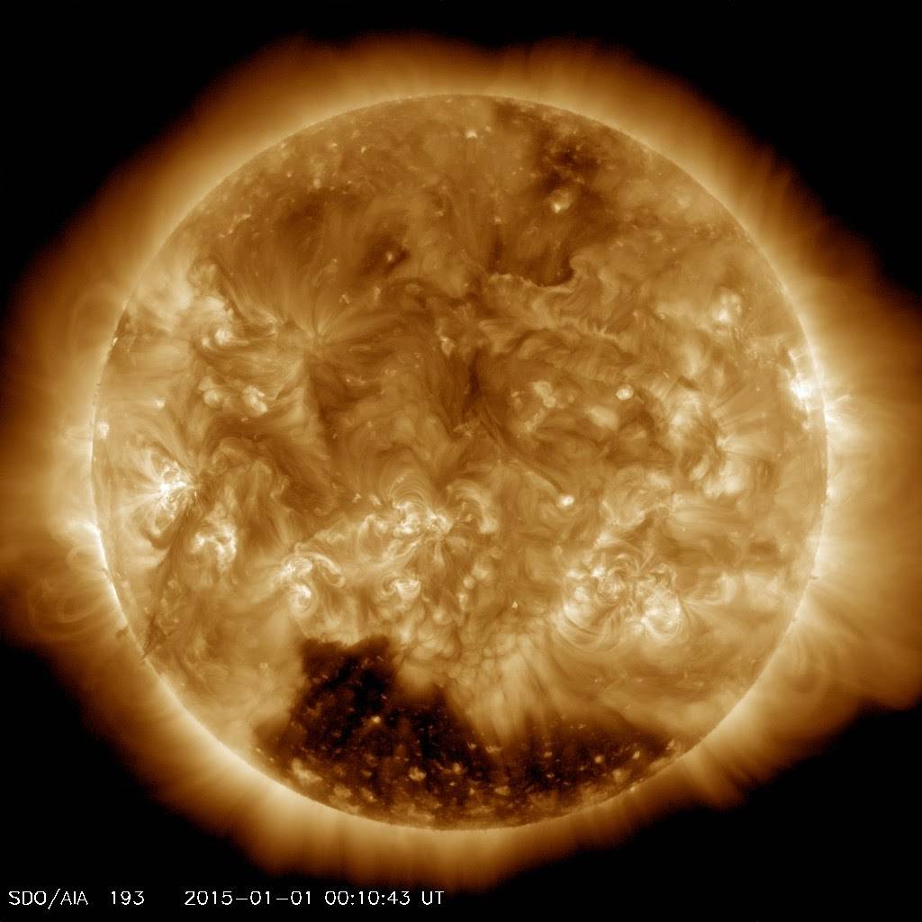 Solar Dynamics Observatory image from January 1, 2015 showing a coronal hole on the sun as a dark region in the south.