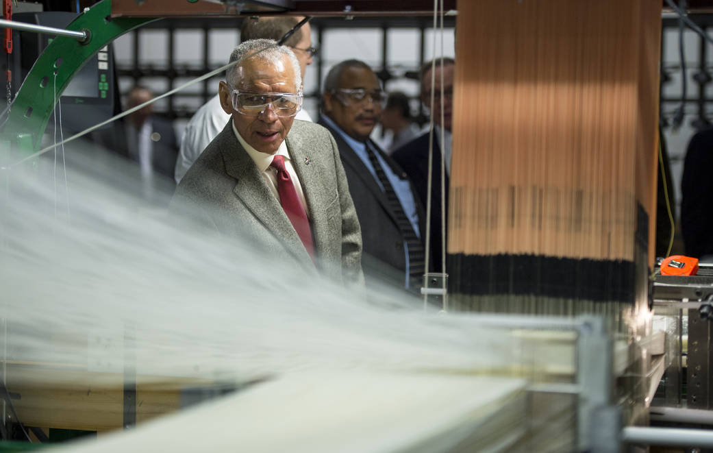 NASA Administrator Charles Bolden inspects a loom at Bally Ribbon Mills (BRM) facility on Friday, Jan. 9, 2015 in Bally, PA. 