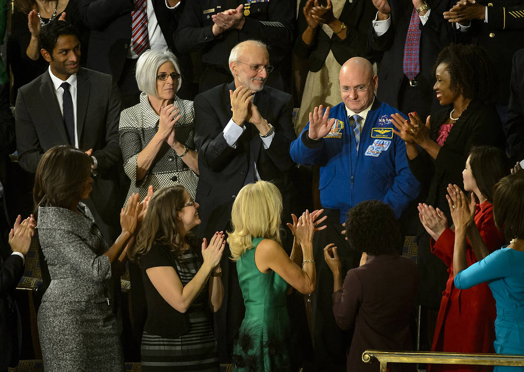 NASA astronaut Scott Kelly stands as he is recognized by President Barack Obama, while First lady Michelle Obama, front left, an